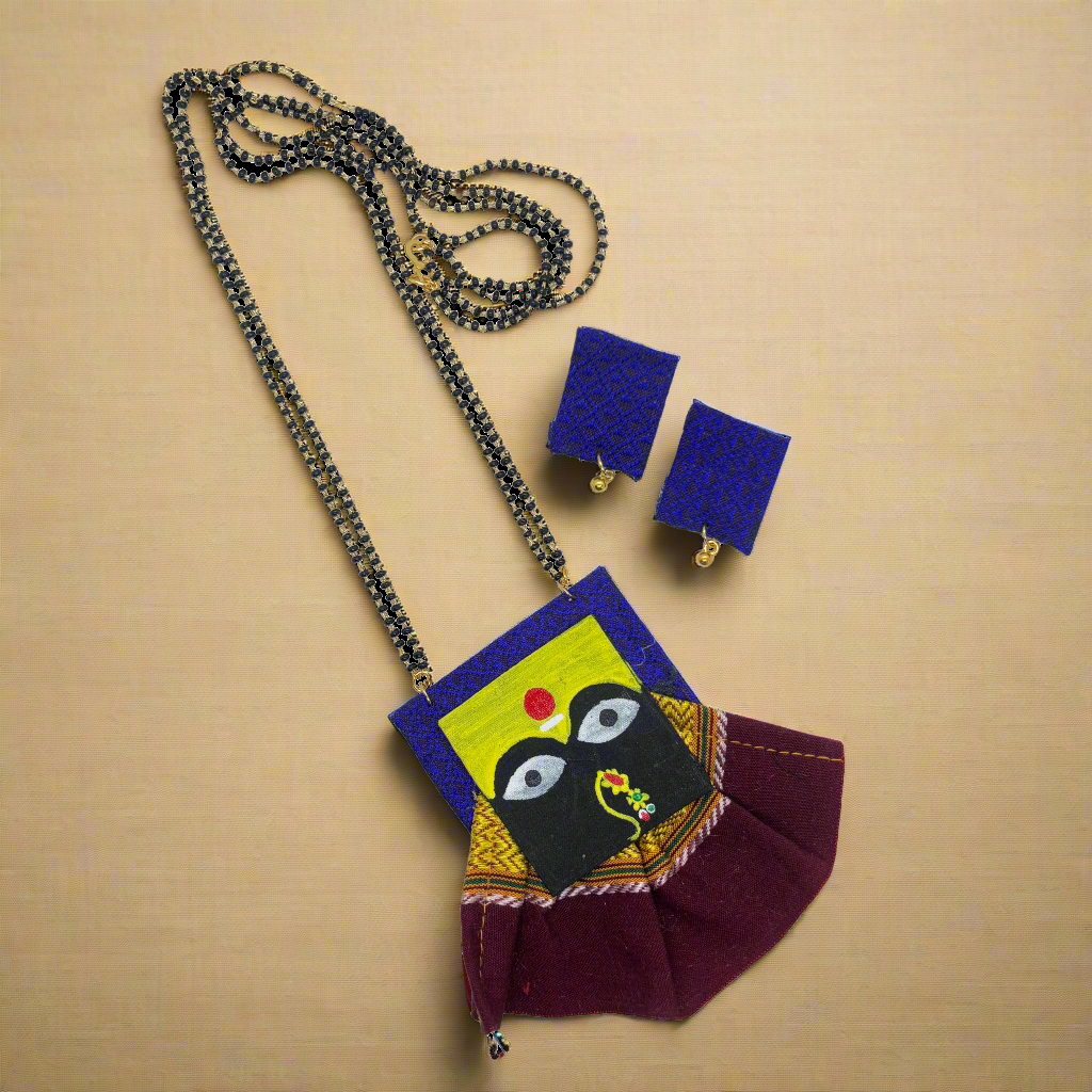 Colorful handbag with matching necklace and earrings on a white background