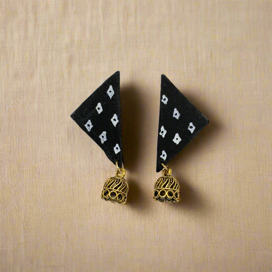 Black triangle-shaped earrings with gold bell charms on a white background