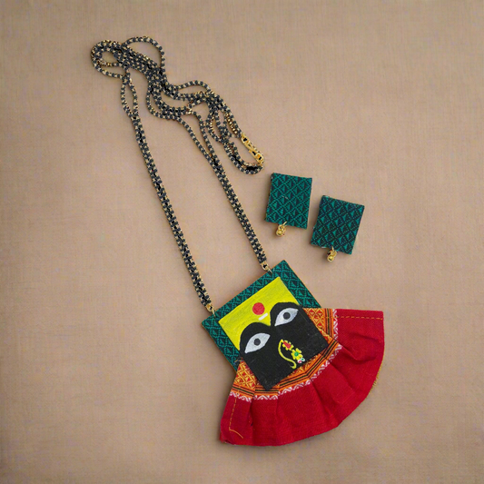Jewelry set with necklace, earrings, and pouch on a white background