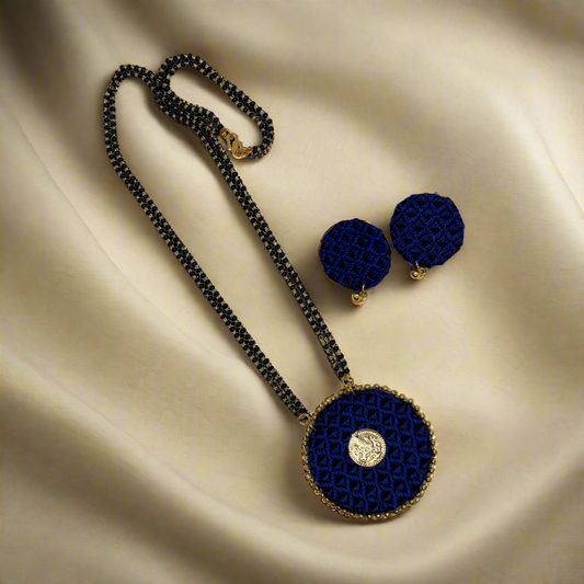 Navy blue beaded necklace and earrings on a white background