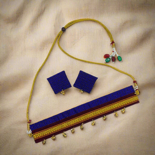 Jewelry set with blue necklace and earrings on a white background