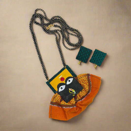 Colorful necklace with pendant and earrings on a white background