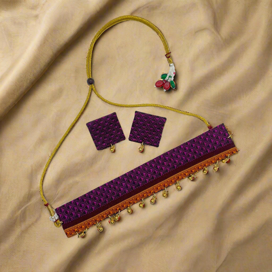 Purple jewelry set with necklace, earrings, and belt on a white background