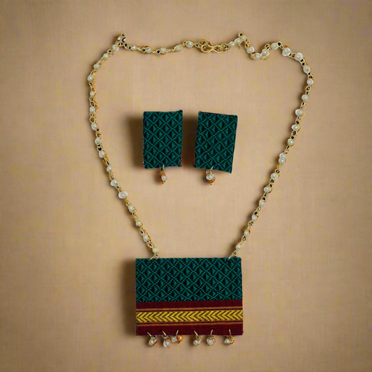 Jewelry set with necklace, earrings, and pouch on a white background